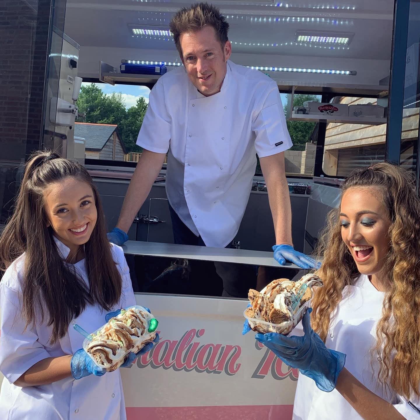 Three Surrey Ices servers holding loaded ice cream trays at the van